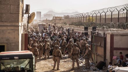 U.S. Marines with Special Purpose Marine Air-Ground Task Force - Crisis Response - Central Command, provide assistance at an Evacuation Control Checkpoi